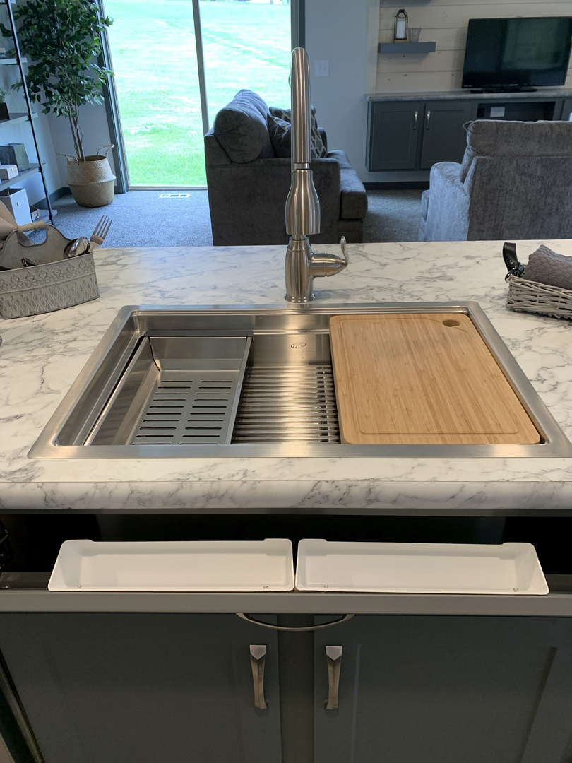 https://www.colony-homes.com/media/uploads/1/13875_Tip-Out-Tray-at-Kitchen-Sink_A32082V_.jpg